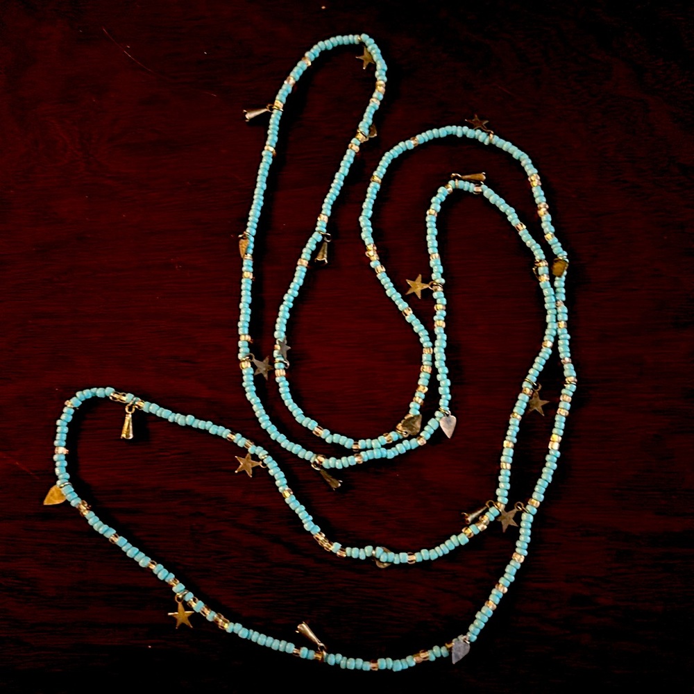 super long blue beaded necklace with star charms